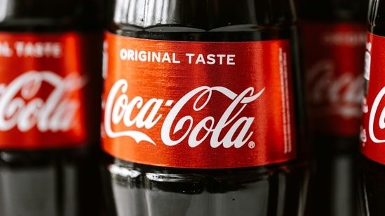 Why are Coca-Cola bottles with yellow caps showing up in American grocery stores? Why people start stocking up