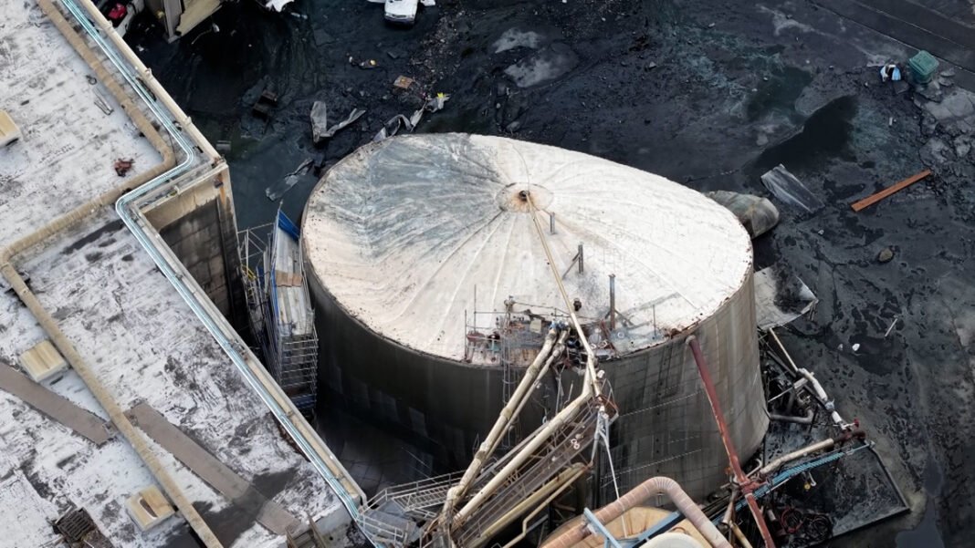 A tank containing 900,000 gallons of corrosive chemicals imploded. Experts say something is seriously wrong

