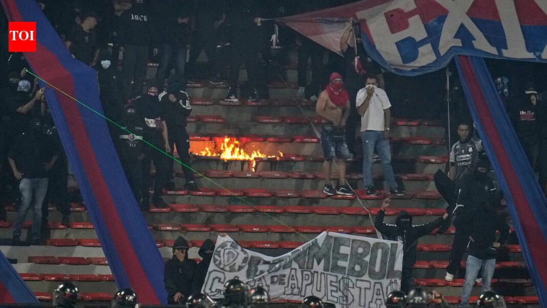 South American Champions League game suspended less than two minutes into the game as fans burned the pitch International Sports News