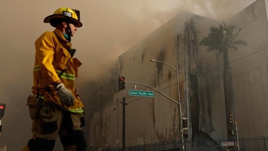 Boyle Heights warehouse fire: Video of lone firefighter battling blaze against horrific backdrop | WATCH